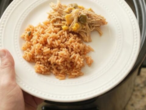 Bubbling Crockpot fiesta chicken with melted Oaxaca cheese and green chiles