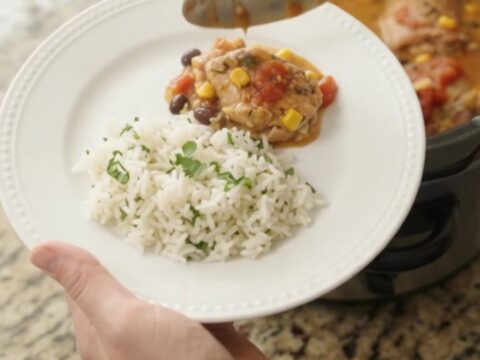 Slow cooker full of creamy cheddar chicken with black beans and corn