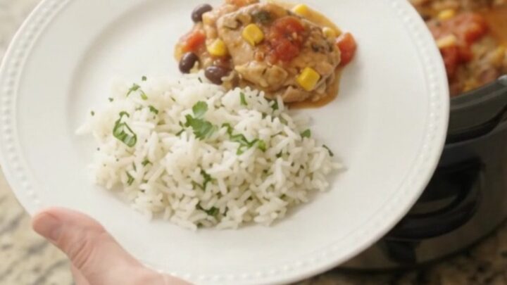 Slow cooker full of creamy cheddar chicken with black beans and corn