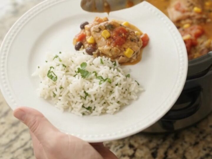 Slow cooker full of creamy cheddar chicken with black beans and corn