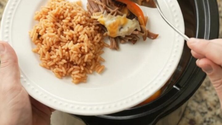 Slow-cooker Oaxaca queso fajita beef barbacoa with melted cheese and peppers
