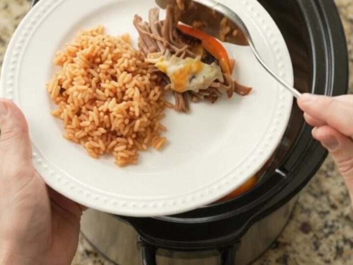 Slow-cooker Oaxaca queso fajita beef barbacoa with melted cheese and peppers