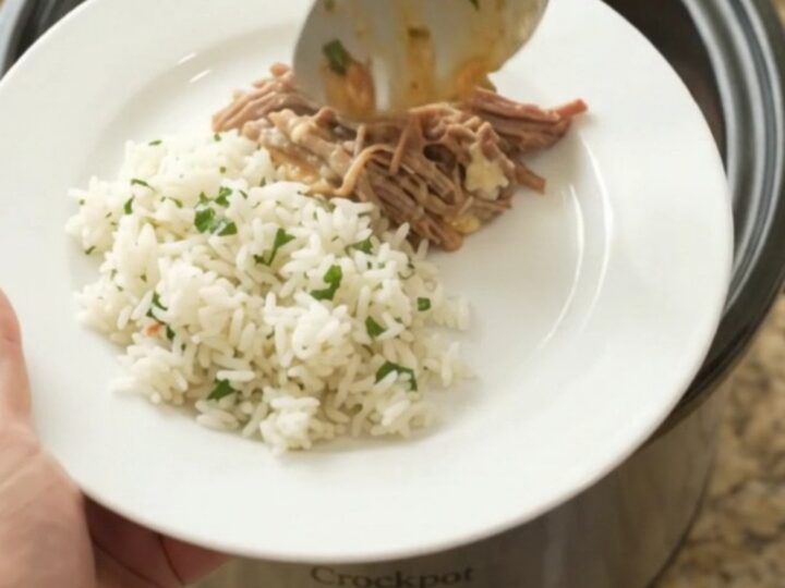 Crockpot Cheddar Rotel Jalapeño Beef Barbacoa in the slow cooker, with creamy sauce and shredded beef