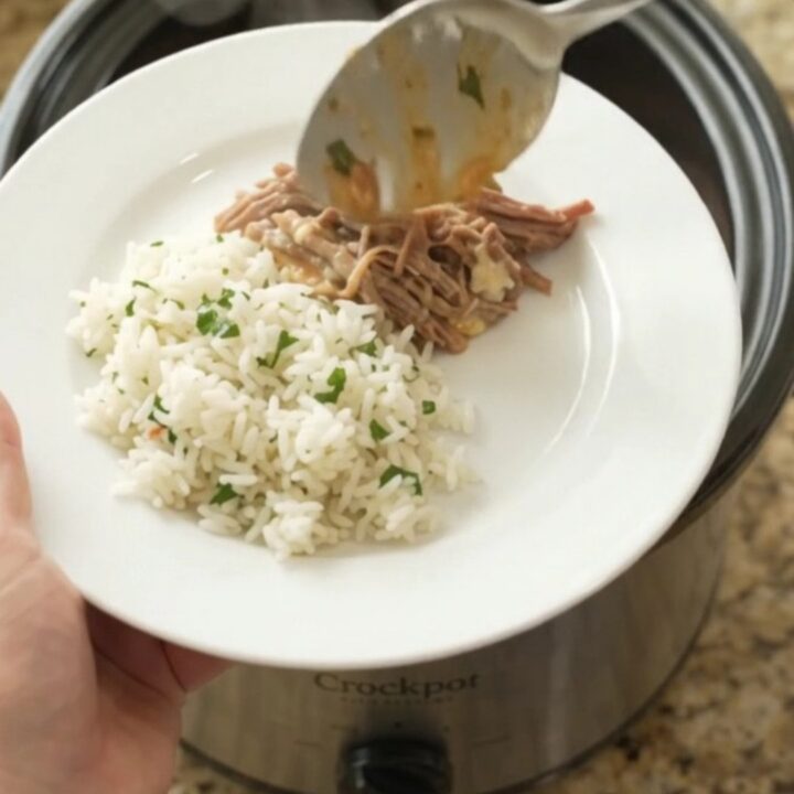 Crockpot Cheddar Rotel Jalapeño Beef Barbacoa in the slow cooker, with creamy sauce and shredded beef