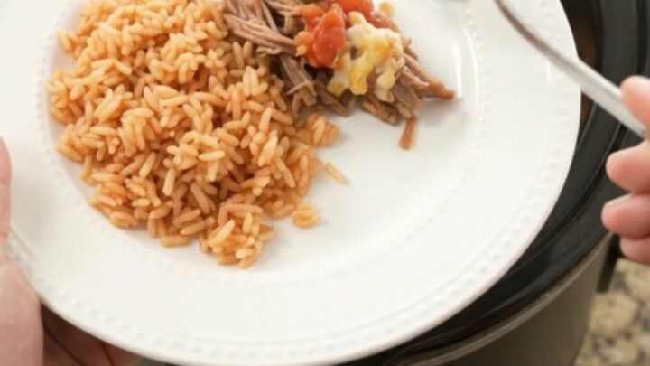 Slow cooker beef barbacoa with melted Oaxaca cheese and jalapeños