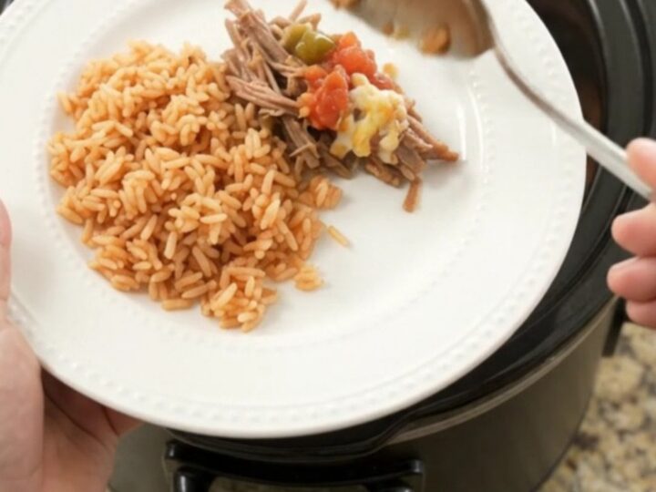Slow cooker beef barbacoa with melted Oaxaca cheese and jalapeños