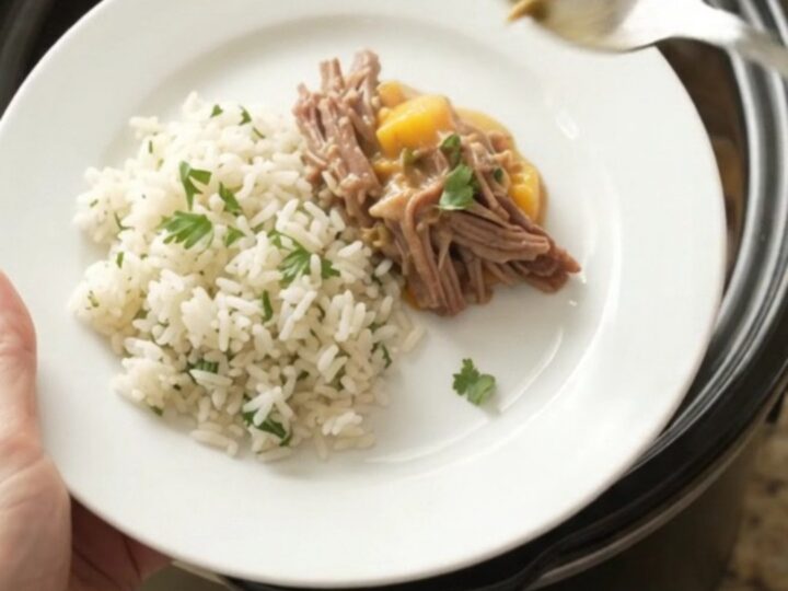 Shredded beef barbacoa in creamy mango habanero cheese sauce in a slow cooker