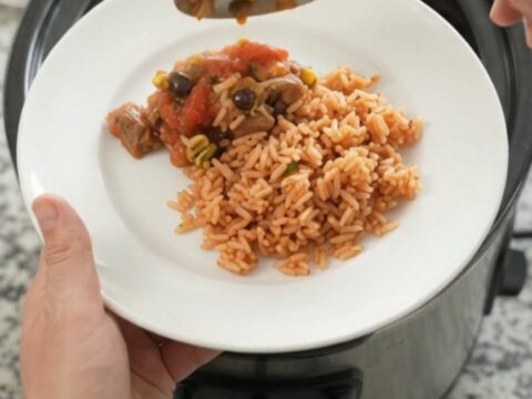 Slow cooker pork carnitas with melted Oaxaca cheese and black beans