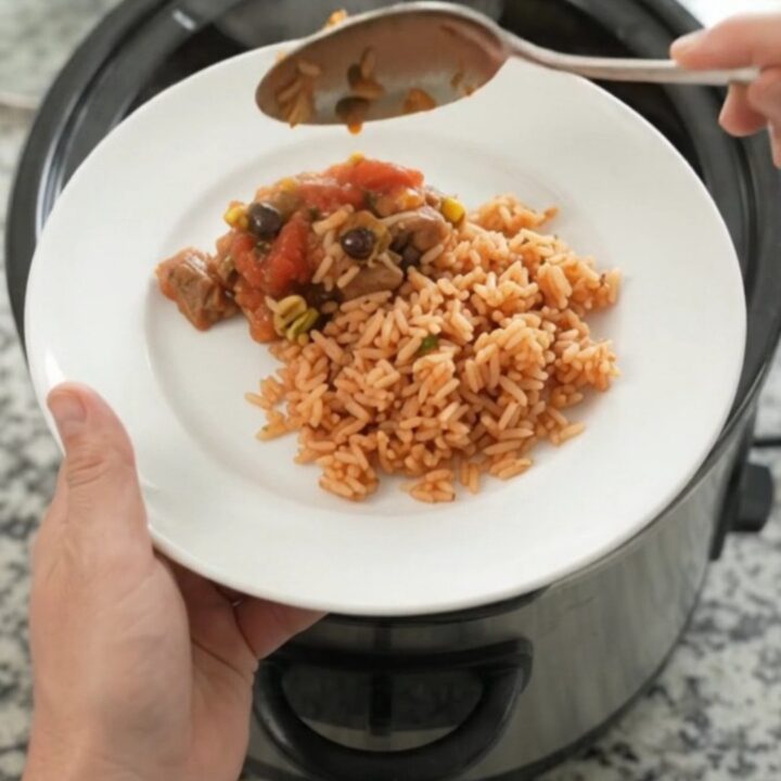 Slow cooker pork carnitas with melted Oaxaca cheese and black beans