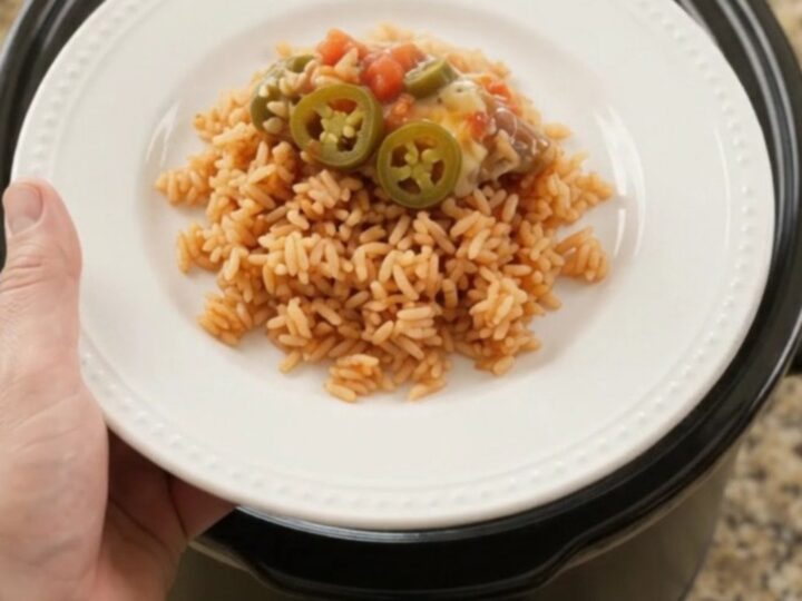 Bubbling slow-cooker pork carnitas with melted Oaxaca cheese and tomato-jalapeño sauce, topped with pickled jalapeños