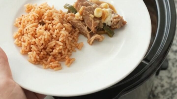 Slow cooker pork carnitas with melted Oaxaca cheese, hominy, and roasted poblanos.