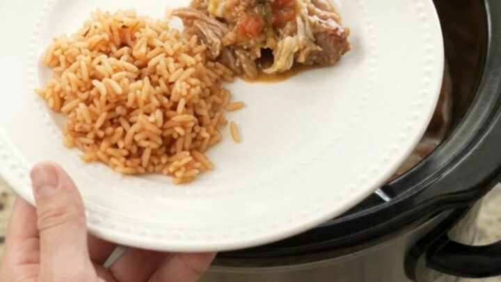Bubbling Crockpot Oaxaca Queso Pinto Carnitas with melted cheese and shredded pork