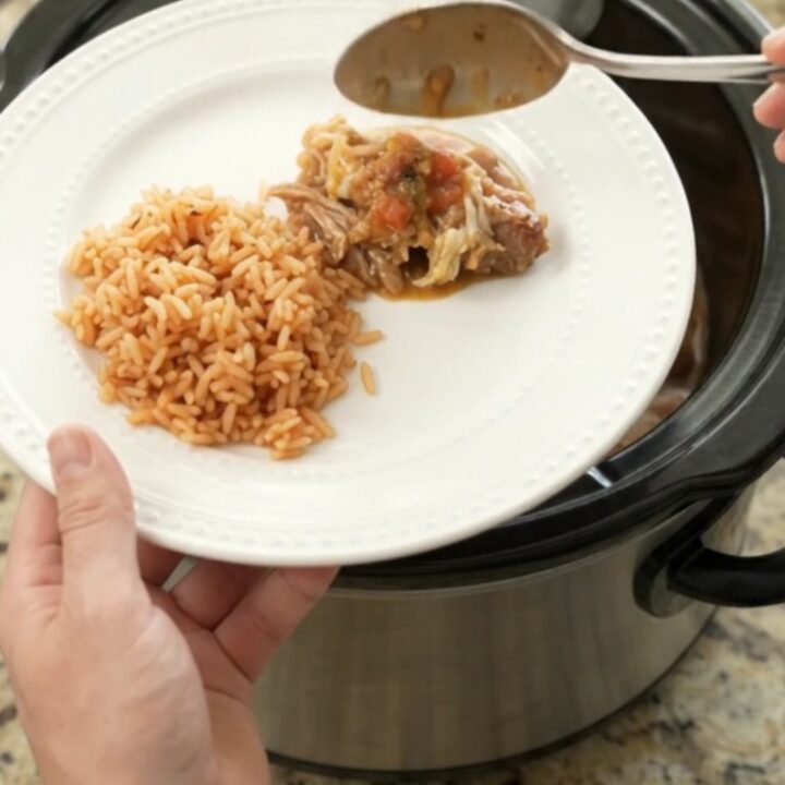 Bubbling Crockpot Oaxaca Queso Pinto Carnitas with melted cheese and shredded pork