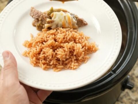 Slow-cooker skirt steak with salsa verde and melted Oaxaca cheese, bubbling in the crockpot