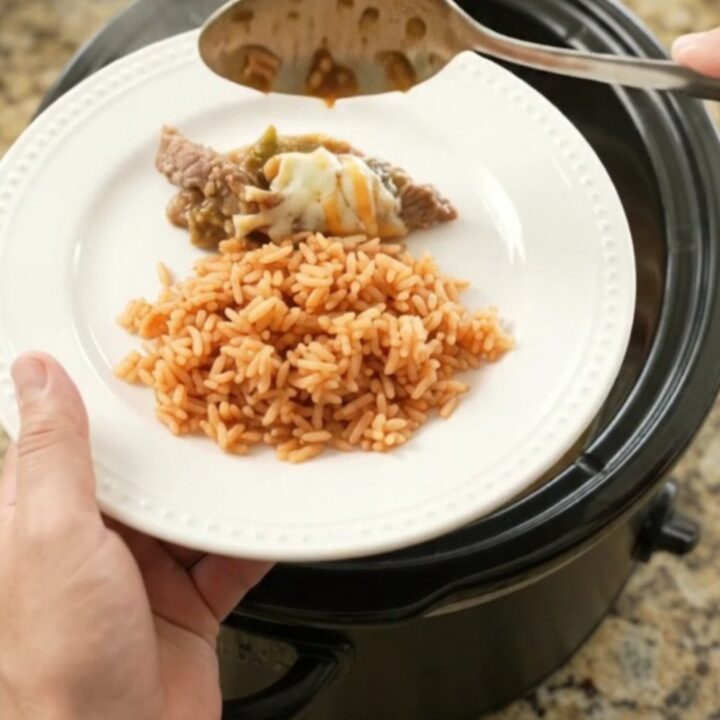 Slow-cooker skirt steak with salsa verde and melted Oaxaca cheese, bubbling in the crockpot