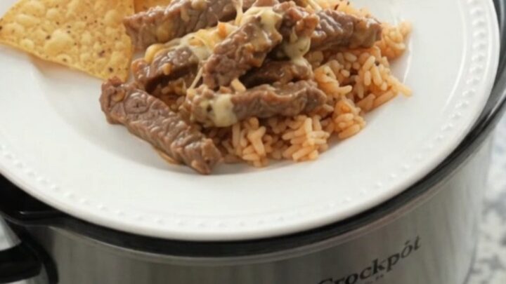 Slow cooker with tender skirt steak in creamy chipotle pineapple queso sauce