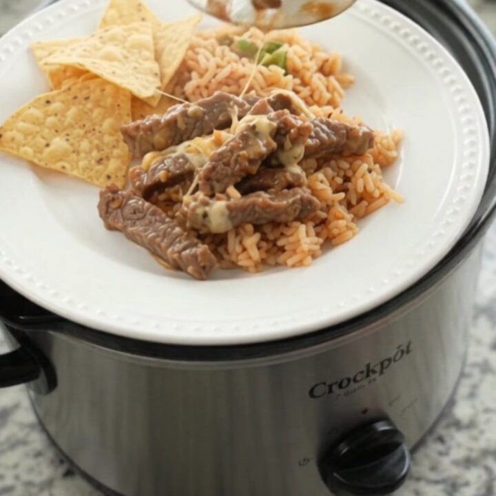 Slow cooker with tender skirt steak in creamy chipotle pineapple queso sauce