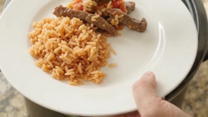 Slow cooker with bubbling cheese and steak strips