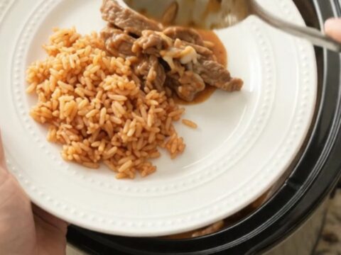 Tender skirt steak strips in a cheesy taco bean sauce in a slow cooker
