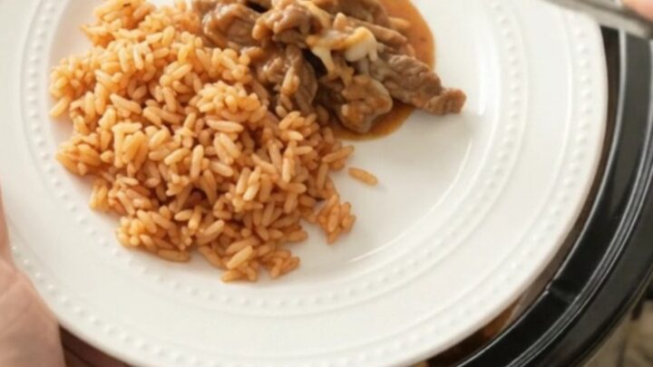 Tender skirt steak strips in a cheesy taco bean sauce in a slow cooker