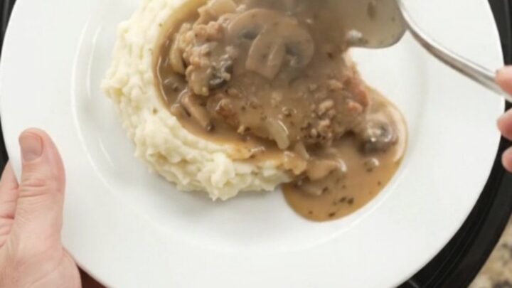 Slow cooker pork chops in creamy mushroom-ranch sauce with butter and cream