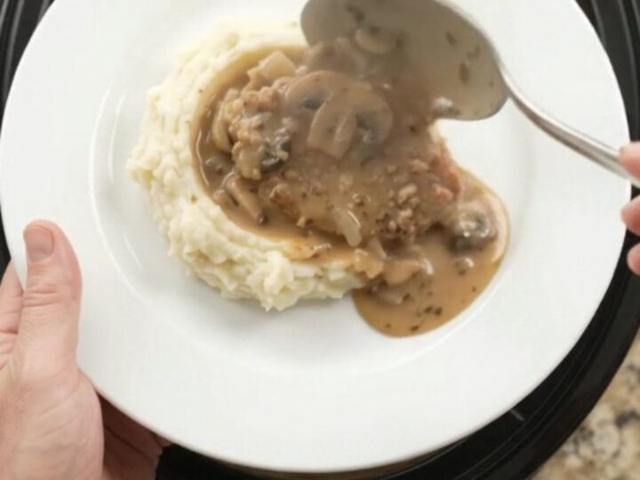 Slow cooker pork chops in creamy mushroom-ranch sauce with butter and cream