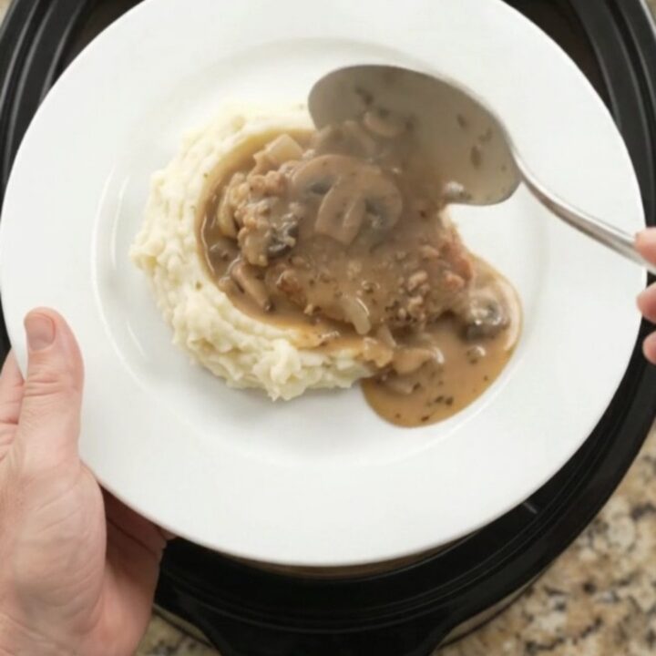Slow cooker pork chops in creamy mushroom-ranch sauce with butter and cream