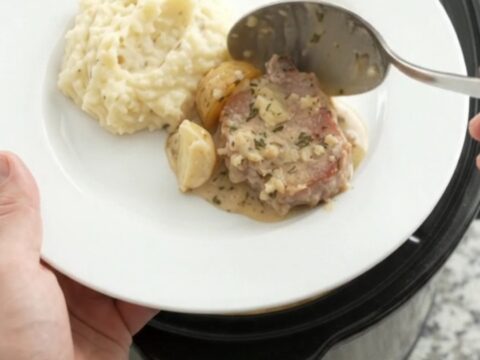 Slow cooker pork chops and potatoes in creamy Gruyère sauce with rosemary