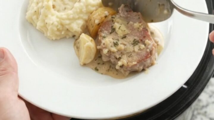 Slow cooker pork chops and potatoes in creamy Gruyère sauce with rosemary