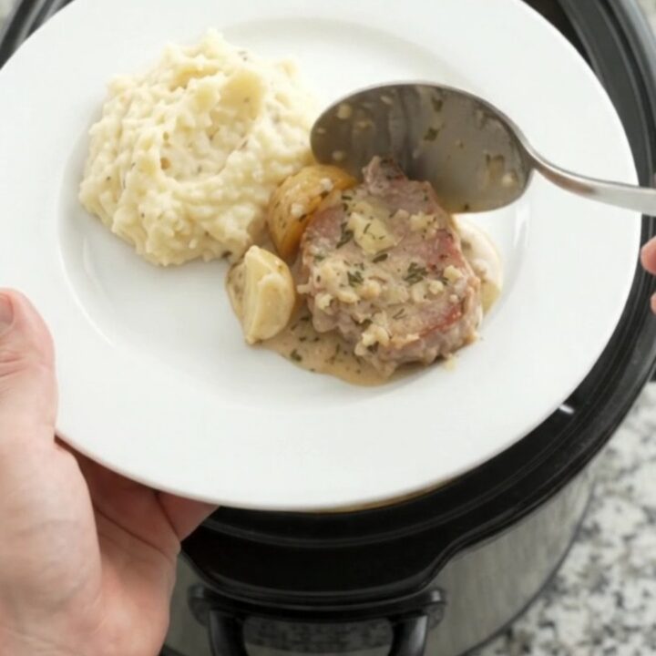 Slow cooker pork chops and potatoes in creamy Gruyère sauce with rosemary