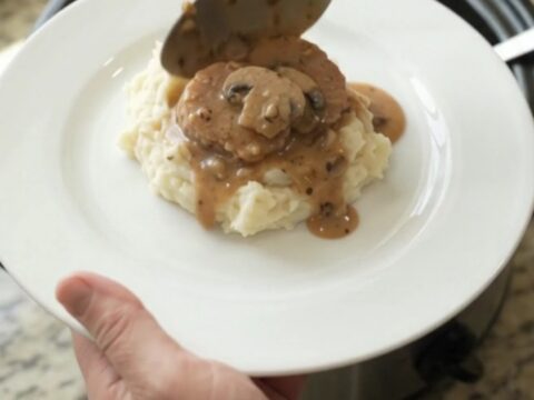 Pork tenderloin medallions in creamy mushroom-ranch sauce in a slow cooker.