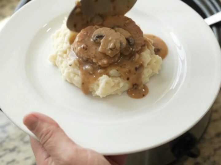 Pork tenderloin medallions in creamy mushroom-ranch sauce in a slow cooker.