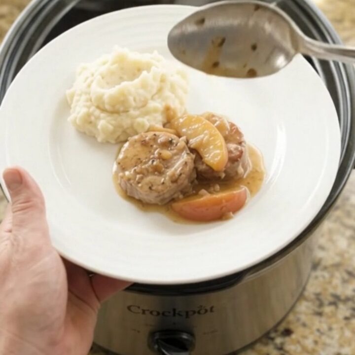 Pork medallions and apples in a creamy butter sauce in a slow cooker