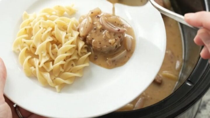 Slow cooker pork medallions in creamy honey-Dijon sauce with shallots, served in the crockpot