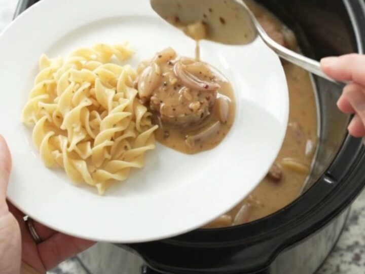 Slow cooker pork medallions in creamy honey-Dijon sauce with shallots, served in the crockpot