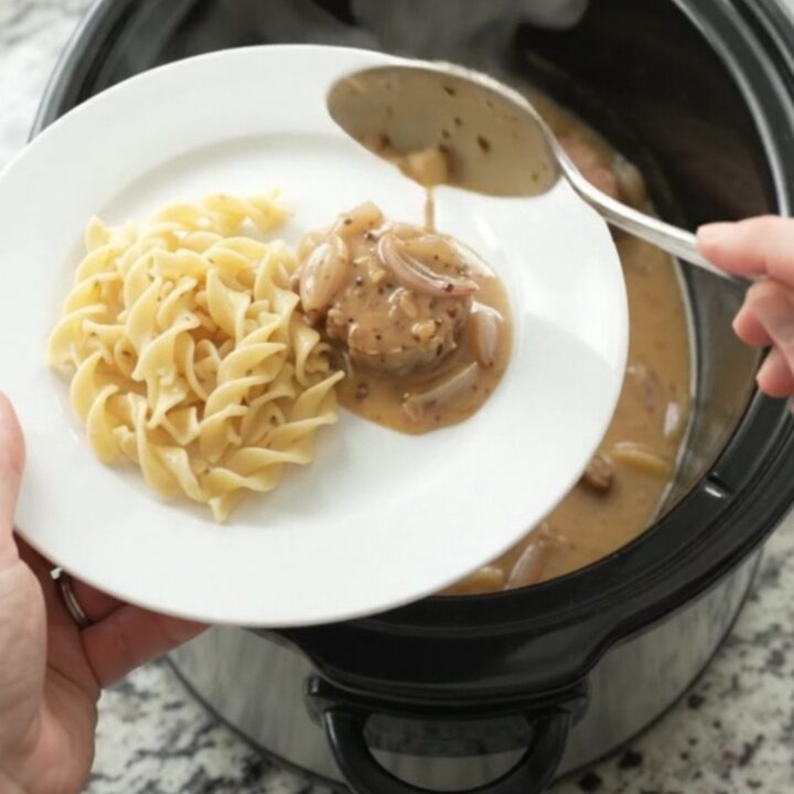 Slow cooker pork medallions in creamy honey-Dijon sauce with shallots, served in the crockpot