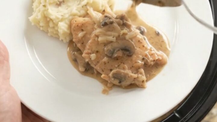 Slow cooker turkey cutlets in creamy mushroom-ranch gravy with melted Gruyère cheese