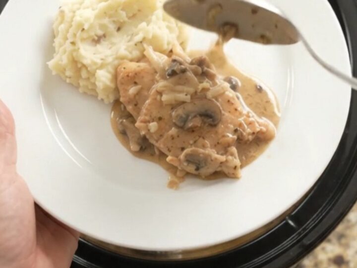 Slow cooker turkey cutlets in creamy mushroom-ranch gravy with melted Gruyère cheese