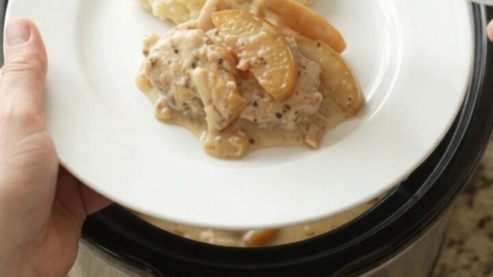 Tender turkey cutlets in a creamy Gruyère sauce with caramelized apples, served from a slow cooker.