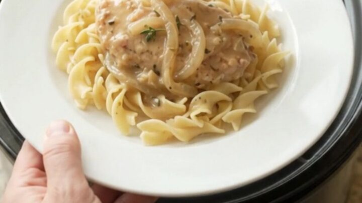 Smothered turkey cutlets in creamy sour cream French onion gravy in a slow cooker