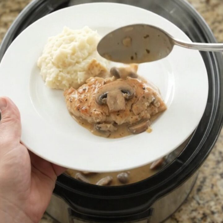 Crockpot chicken cutlets in creamy mushroom ranch sauce with butter and herbs