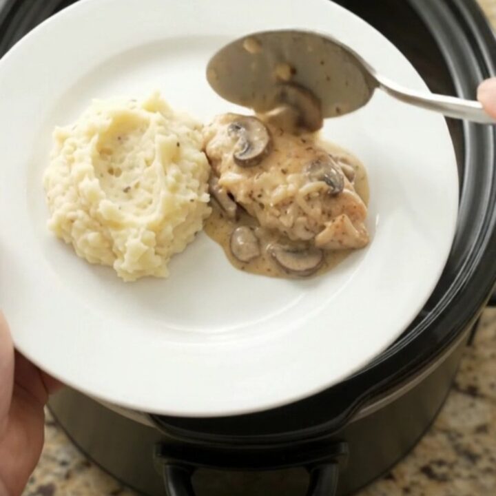 Slow cooker chicken cutlets in creamy mushroom-ranch sauce with melted Gruyère
