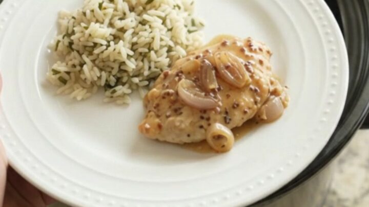 Slow cooker turkey cutlets in creamy honey Dijon sauce with shallots and Parmesan, served in the crockpot.