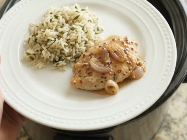 Slow cooker turkey cutlets in creamy honey Dijon sauce with shallots and Parmesan, served in the crockpot.