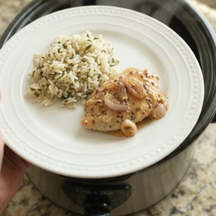 Slow cooker turkey cutlets in creamy honey Dijon sauce with shallots and Parmesan, served in the crockpot.