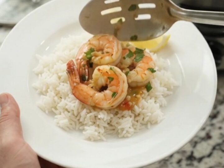 Slow cooker shrimp boil with jumbo shrimp, corn, and potatoes in chili-lime butter sauce
