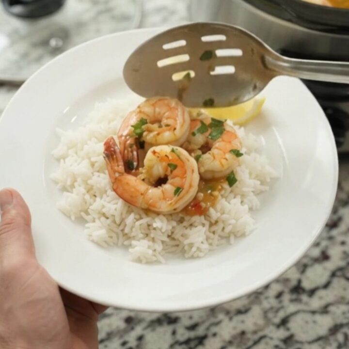 Slow cooker shrimp boil with jumbo shrimp, corn, and potatoes in chili-lime butter sauce