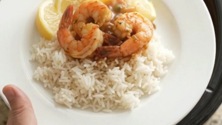 Bayou Butter Cajun Boil Jumbo Shrimp in a slow cooker with corn and potatoes in a red butter sauce