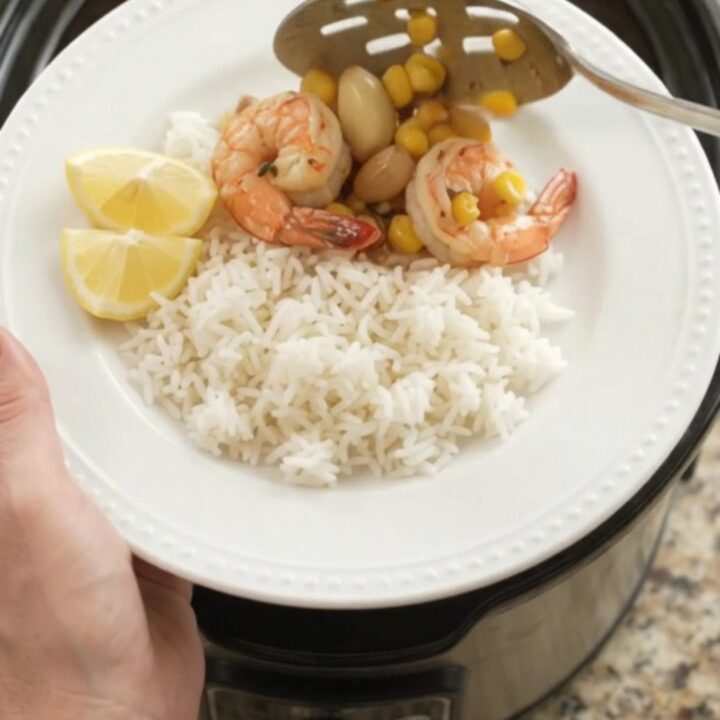 Crockpot chili lime butter shrimp with corn and garlic in a glossy sauce