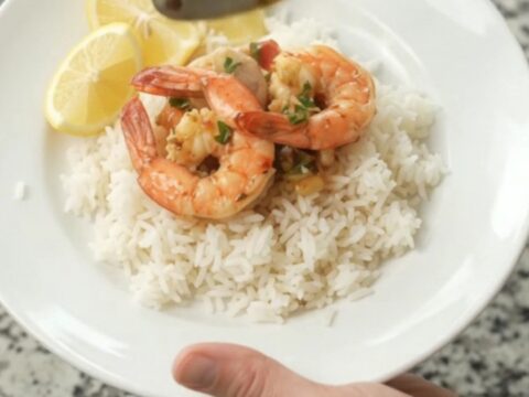 Slow cooker seafood boil with snow crab, shrimp, corn, and potatoes in chili-lime butter sauce